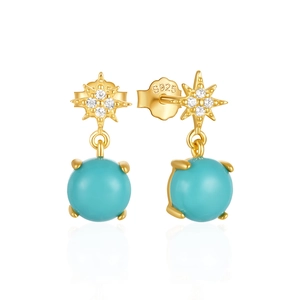 Detailed macro view of 925 silver star earrings with turquoise beads and white zircon