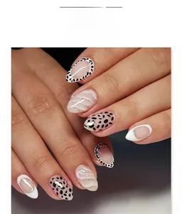 Macro detail of almond nails with black leopard spots and silver glitter wavy lines