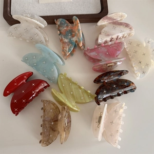 Set of starry rhinestone acetate hair claws in various marble and solid colors for women