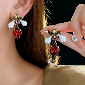 Vintage gold-plated bee earrings with colorful crystals and red pear-shaped gemstones