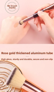 Detail of rose gold thickened aluminum tube and soft fiber bristles of dual-head brush