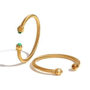 Chic gold twisted cable C-shape bangle with hexagonal nut ends and inlaid semi-precious stones