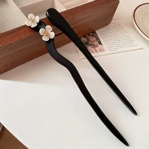 Classic Chinese style black wood hair sticks with white flower and golden stamen detail