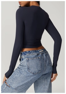 Detail of slim fit dark blue crop top featuring high-elastic fabric for yoga and running
