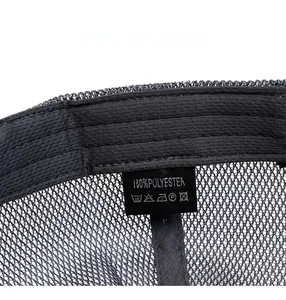Detail of breathable mesh fabric and 100% polyester wash label inside the dark grey cap