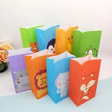 Detail view of colorful cartoon animal paper gift bags featuring lions and elephants