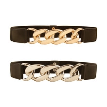 Detail of two gold metal buckle elastic waist belts with glossy and matte finishes