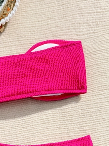 Close-up of rose red seersucker bikini top with built-in removable circular pads