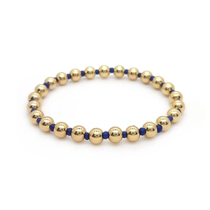 Minimalist 18K gold-plated beaded bracelet with blue accent beads on white background