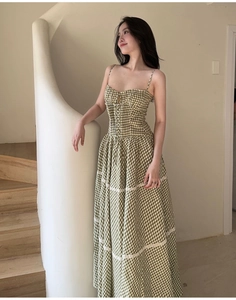 Detail of French floral maxi dress featuring lace trim and lace-up bodice design