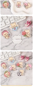 Detail of cute acrylic bear brooches showing metal pin backing and colorful UV printing