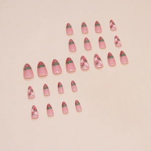 Cat eye almond press-on nails with sweet strawberry and floral designs in light pink