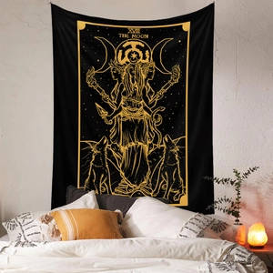 Detail of Bohemian black and gold Moon Tarot tapestry hanging as a bedroom wall decoration