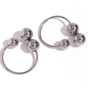 Polished silver stainless steel hoop earrings with three balls and modern industrial design