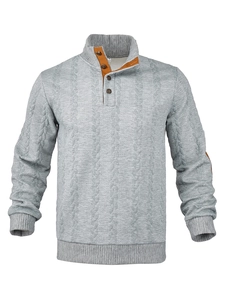 Detail view of the gray waffle knit sweater featuring brown elbow patches and button collar