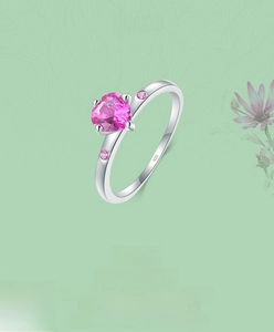 Macro shot of S925 silver ring featuring a pink heart zircon and 925 engraving mark