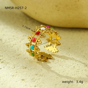Detail showing 1.13cm width and dimensions of the wave-edged gold-plated colorful ring