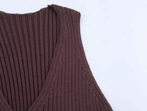Detailed close-up of brown knit ribbed fabric texture on women's ruffle sleeve top