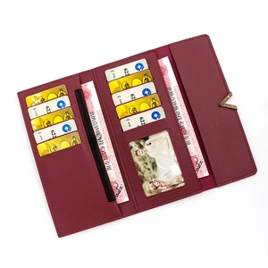 Elegant wine red PU leather trifold wallet with multiple card slots and V-shaped metal trim