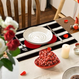 Linen placemat with black stripes and red heart dots for Valentine's table decor