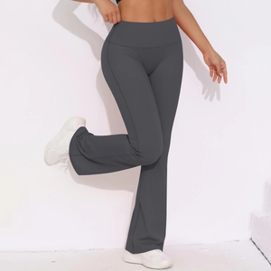 Macro view of wide waistband and flared leg on dark grey high-waisted yoga pants
