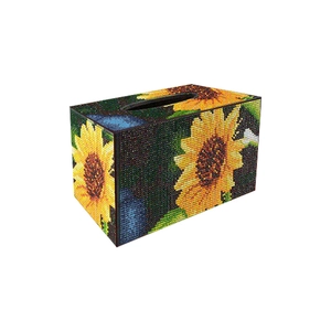 DIY diamond painting tissue box holder with yellow sunflower pattern on dark blue base