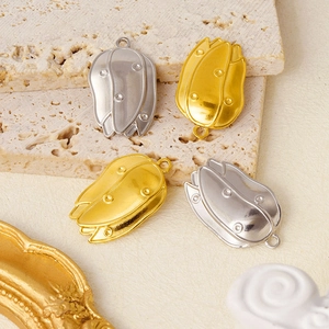 Detailed view of elegant flower bud pendants in gold and silver for DIY jewelry making