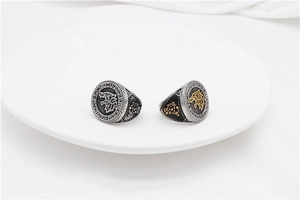 Detailed close-up of retro Viking wolf rings featuring intricate runic engravings