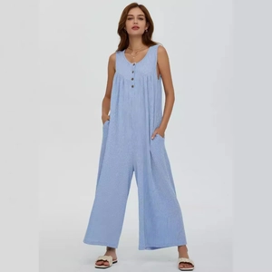 Sleeveless light blue striped wide-leg jumpsuit with pockets and button detail
