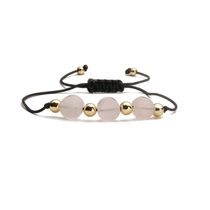 Detail of adjustable black woven bracelet with pink stone beads and gold spheres