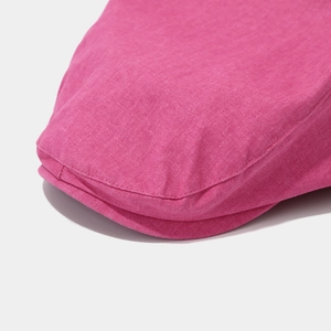 Detail of rose pink newsboy hat showing high-quality twill cotton texture and stitching