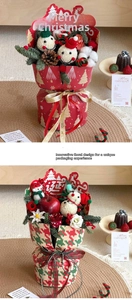 Detailed Christmas bouquet packaging with festive red apple, roses, and pine cone decor