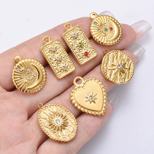 7-piece gold stainless steel pendant set with stars moons and colorful rhinestones