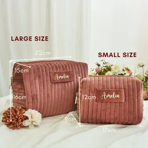 Detailed size comparison and measurements for large and small corduroy makeup bags