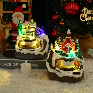 Rotating musical LED Christmas village resin ornament with snowy town and Santa Claus