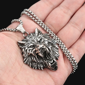 Detailed close-up of a silver stainless steel Viking wolf head pendant with square link chain