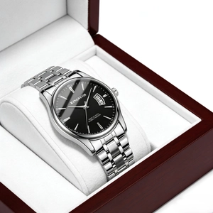 Detail view of steel business watch with black dial and calendar display in wooden box