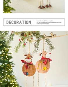 Detail of wooden Christmas reindeer pendant with striped scarf and rustic metal bell decor