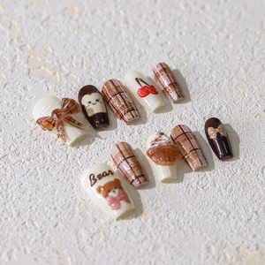 Bear themed press-on nail kit with latte-brown plaid patterns and 3D bow accents