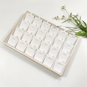 24-slot gold jewelry display tray with white brushed leather lining for necklaces