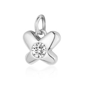 Macro shot of silver butterfly-shaped zircon pendant with polished finish and center gemstone