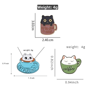 Detailed view of enamel cat pins featuring creative Catpuccino and Catffee cup designs