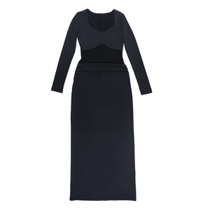 Detail of elegant black dress featuring a sweetheart neckline and stylish waist cut-outs