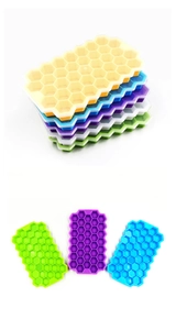 Macro detail of honeycomb silicone ice cube molds in various vibrant pastel colors