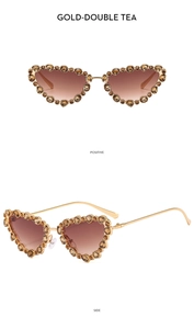 Detailed view of gold cat-eye sunglasses with crystal rhinestones and tea gradient lenses