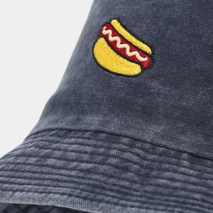 Washed navy bucket hat featuring detailed hot dog embroidery and vintage canvas texture