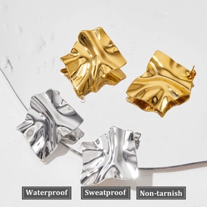 Irregular geometric pleated metal earrings in gold and silver with waterproof finish