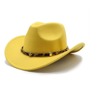 Detail of yellow cowboy hat with leopard print band and golden star metal accents