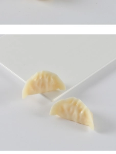 Detailed realistic PVC dumpling food models with translucent texture and fine pleats