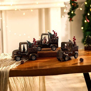 Vintage Christmas truck music box with Santa Claus and tree in warm festive setting